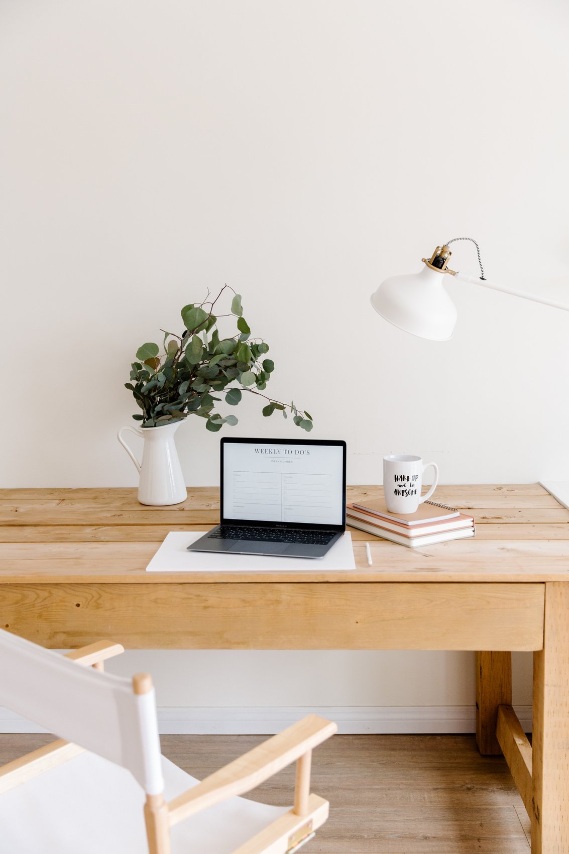 A Chair Near a Desk with a Laptop